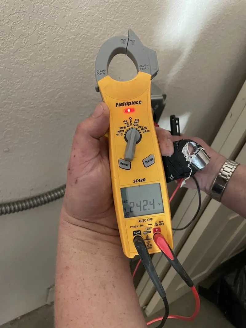 Voltage testing with clamp meter during Outlet Installation in Three Rivers